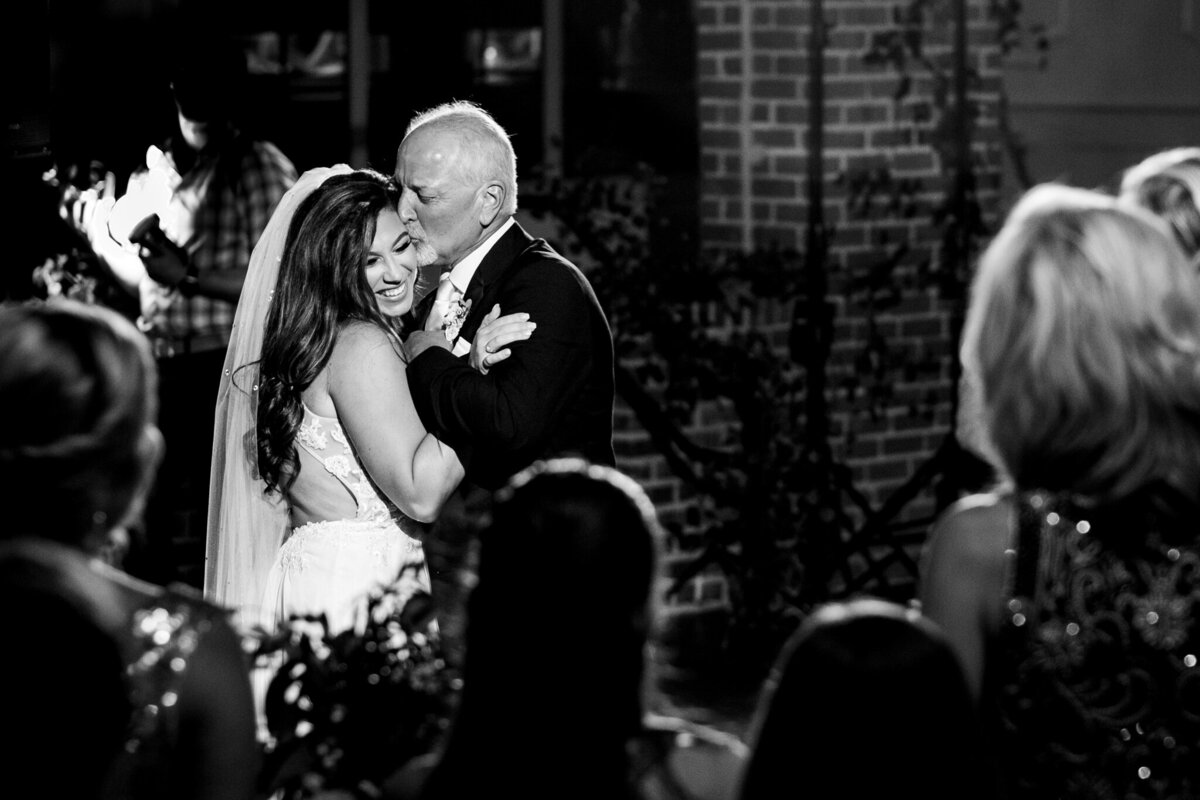 Luxury Portraits by Moving Mountains Photography in Charlotte, NC - Black and white photo of a dads and daughter dance at a wedding