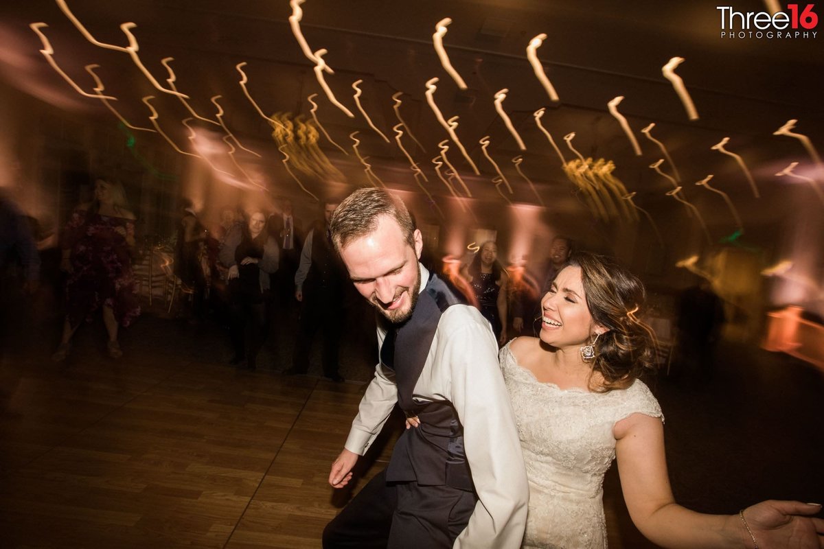 Bride and Groom dance together during the reception
