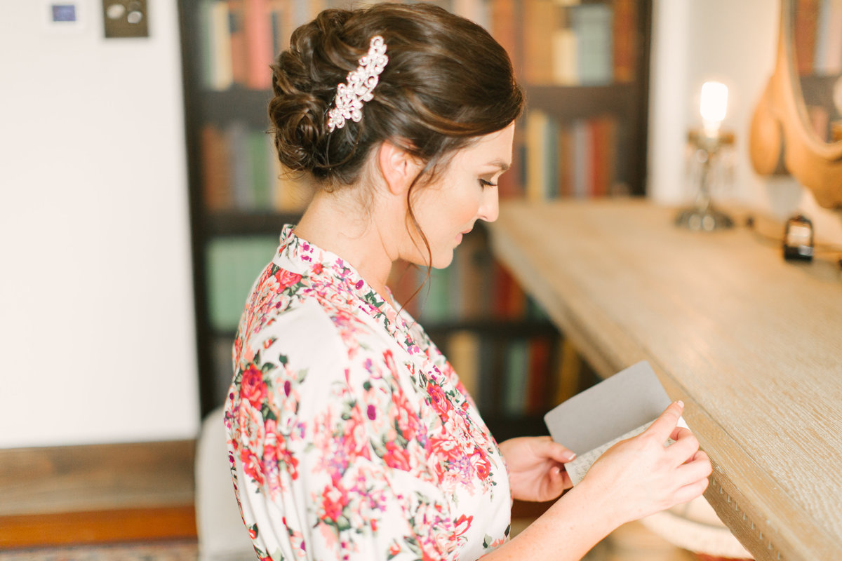 Bride reading vows at 1880 Union Hotel Wedding