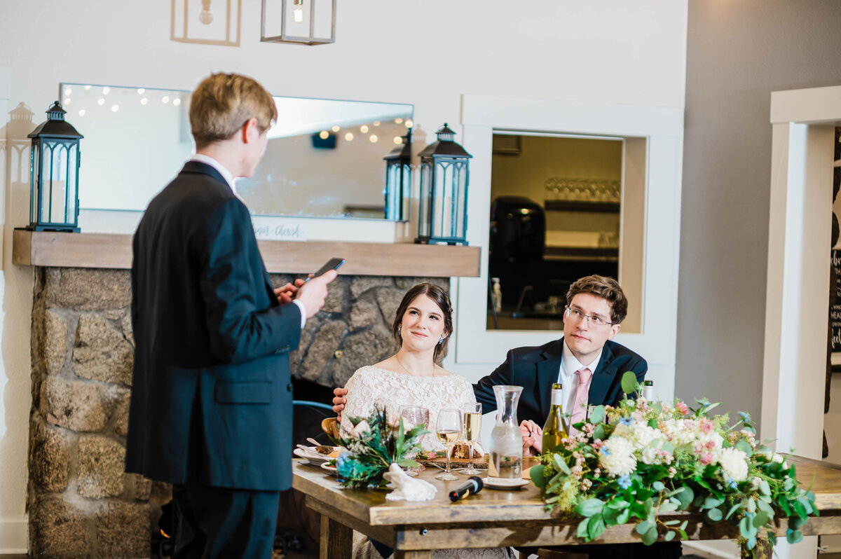 Denver wedding photographer captures a best man toasting a groom on his wedding day captured at Boulder Wedgewood captured by Denver wedding photographer
