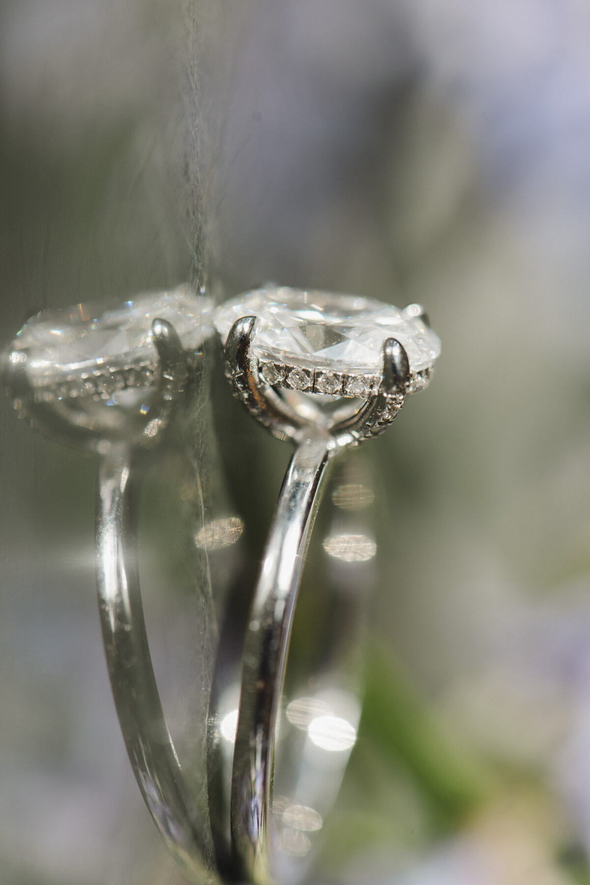 Close up of a ring reflecting on glass.