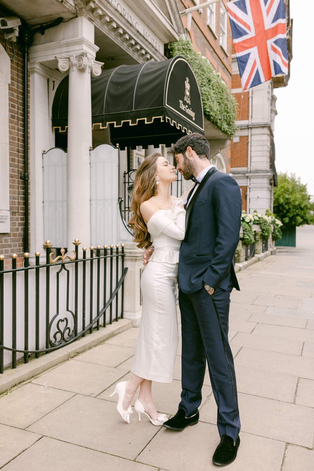 A wedding day photo of the couple in front of the Goring Hotel in London the United Kingdom