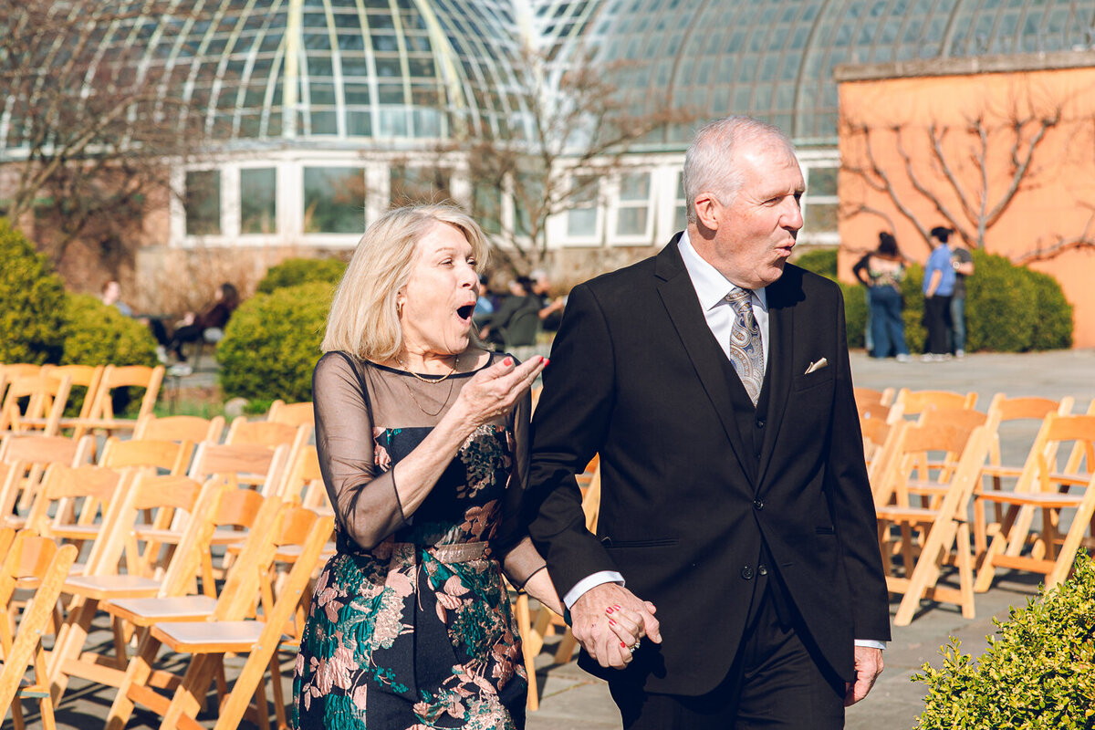  The bride's parents see her for the first time at her wedding at the Garfield Park Conservatory in Chicago