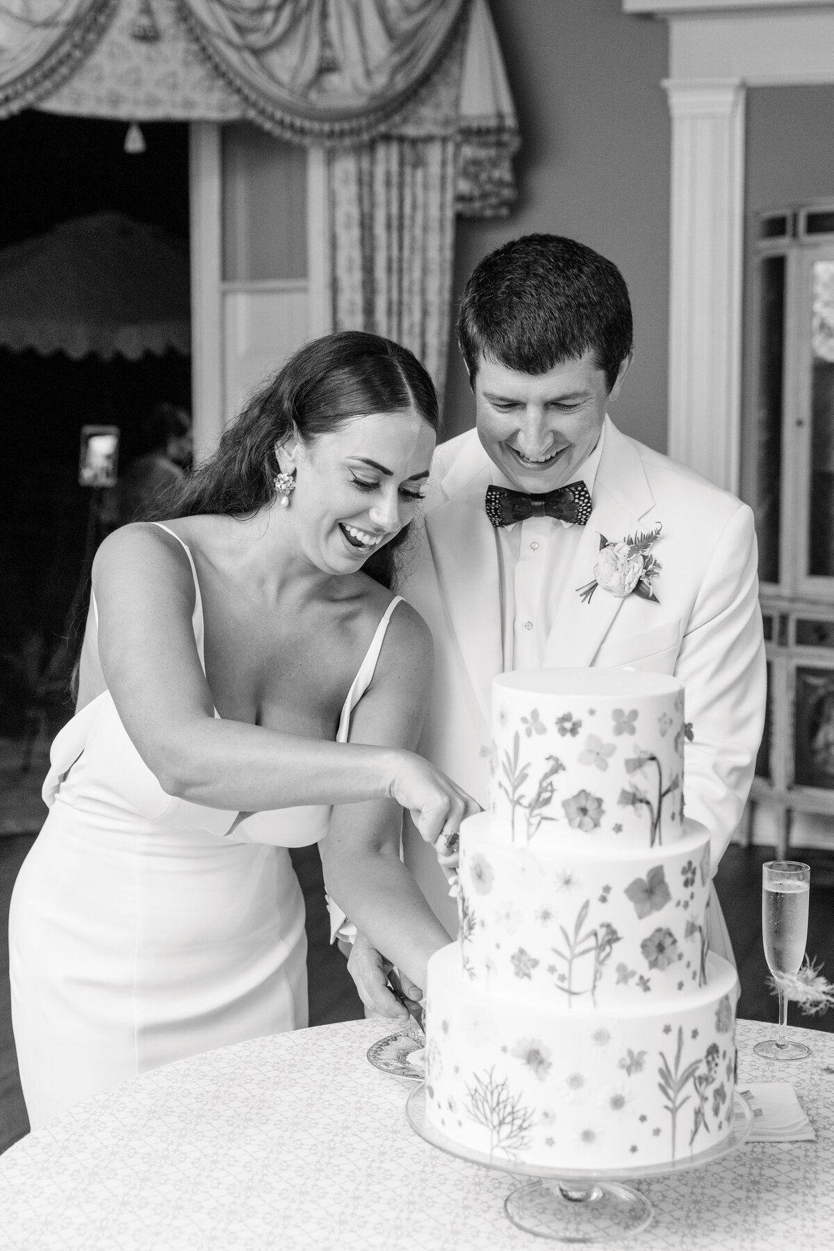 couple cuts their wedding cake