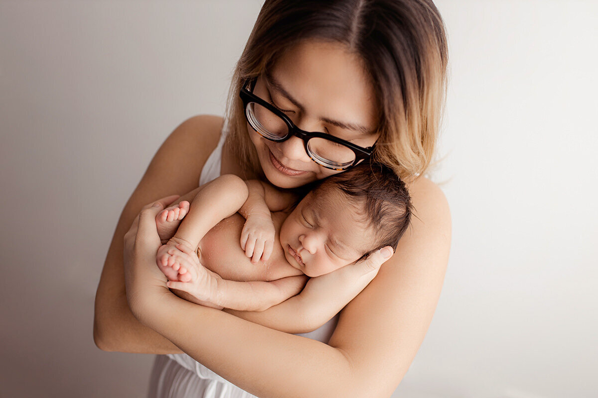 vietnamese-mother-cuddling-her-infant