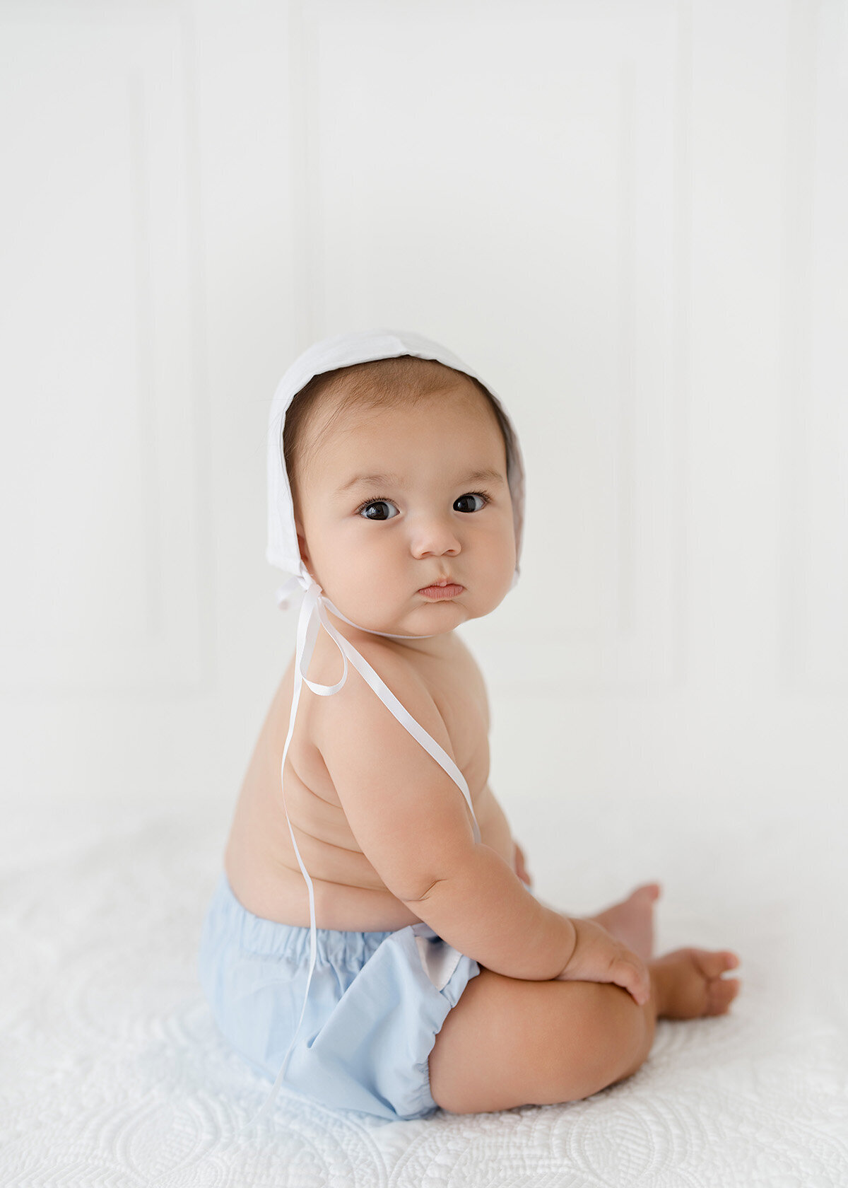baby boy photographed for his sitting session heirloom style in brunswick ga