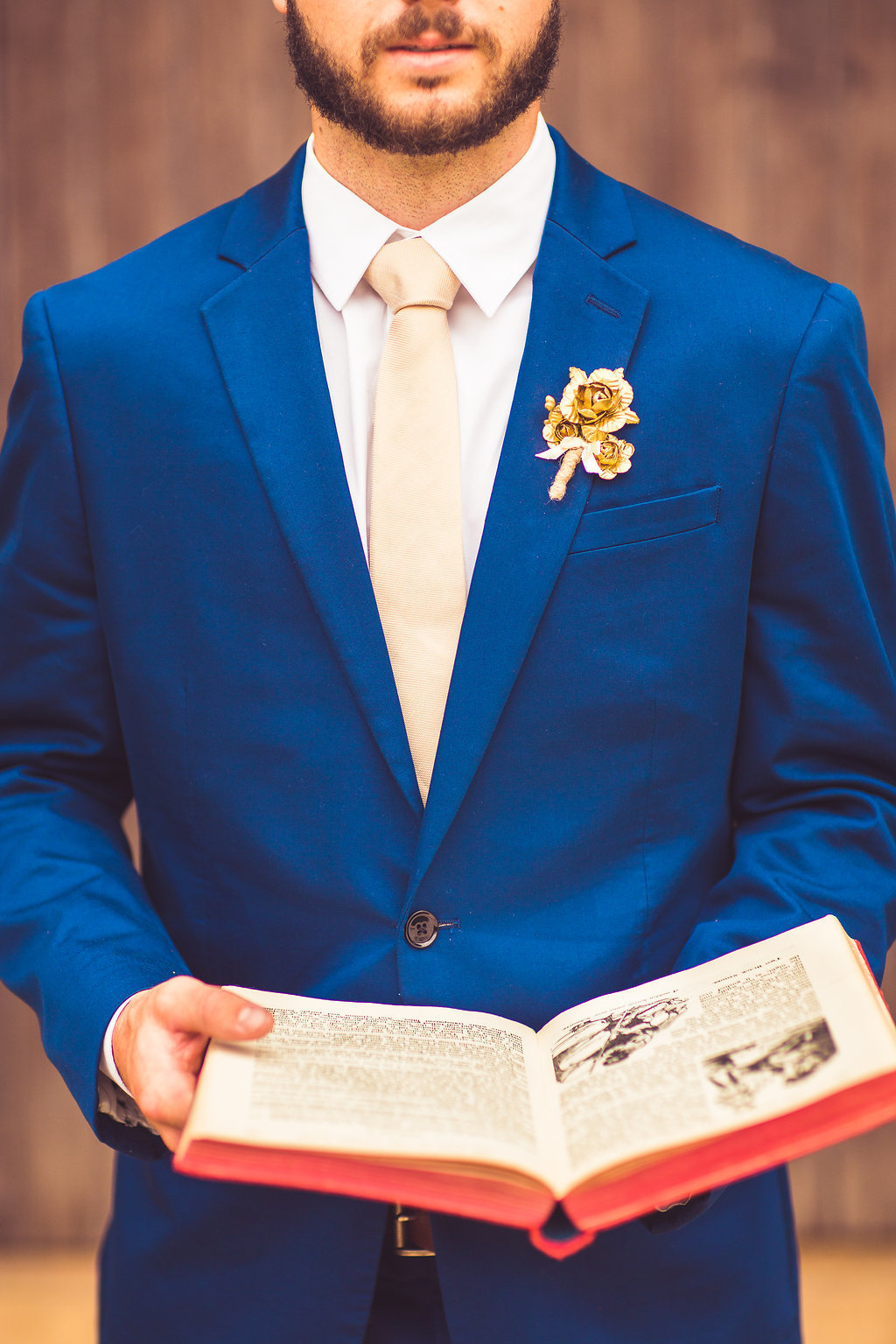 Wedding Photograph Of a Man in Blue Suit Holding a Book Los Angeles