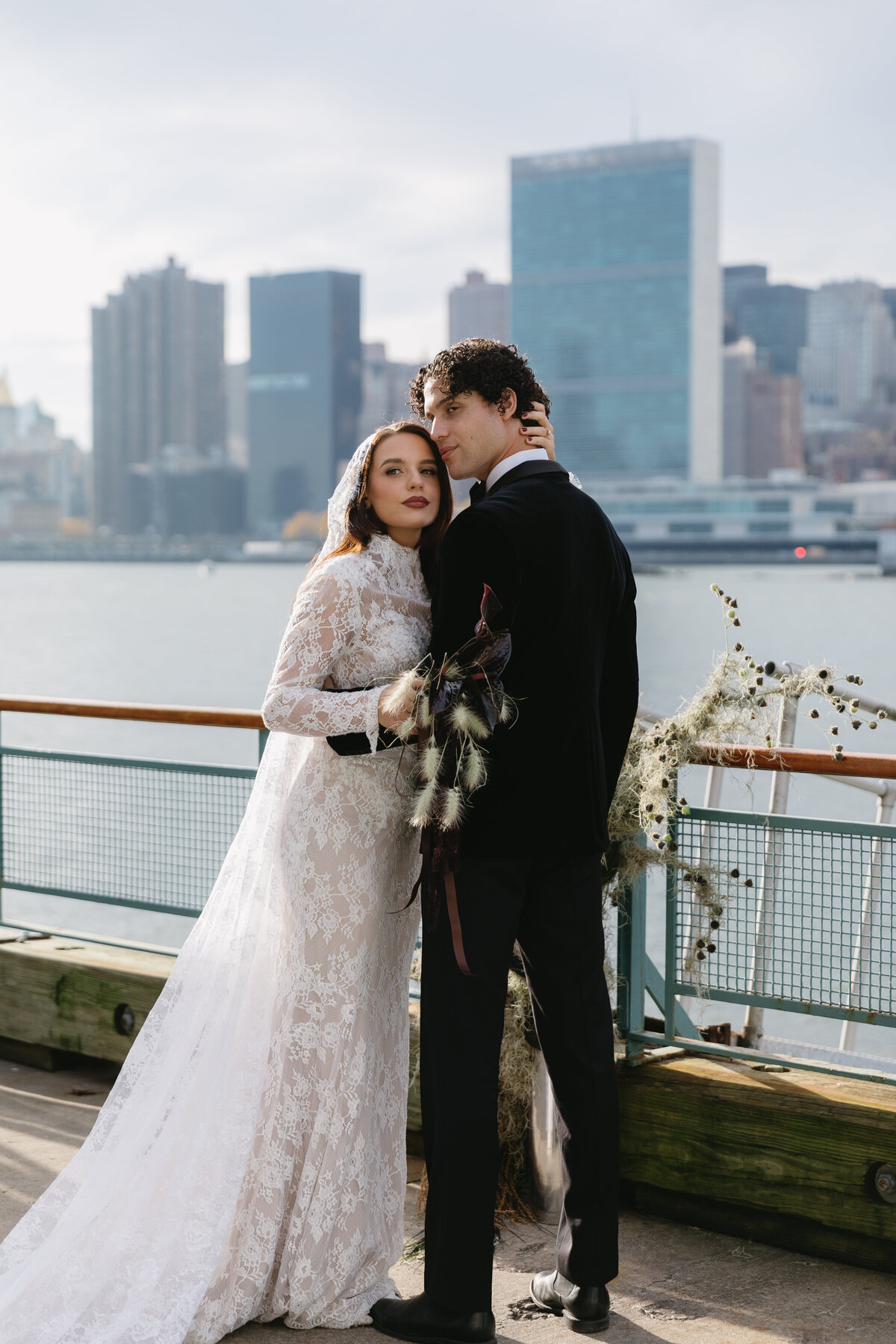meredith-michel-editorial-wedding-couple-embracing-nyc-waterfront