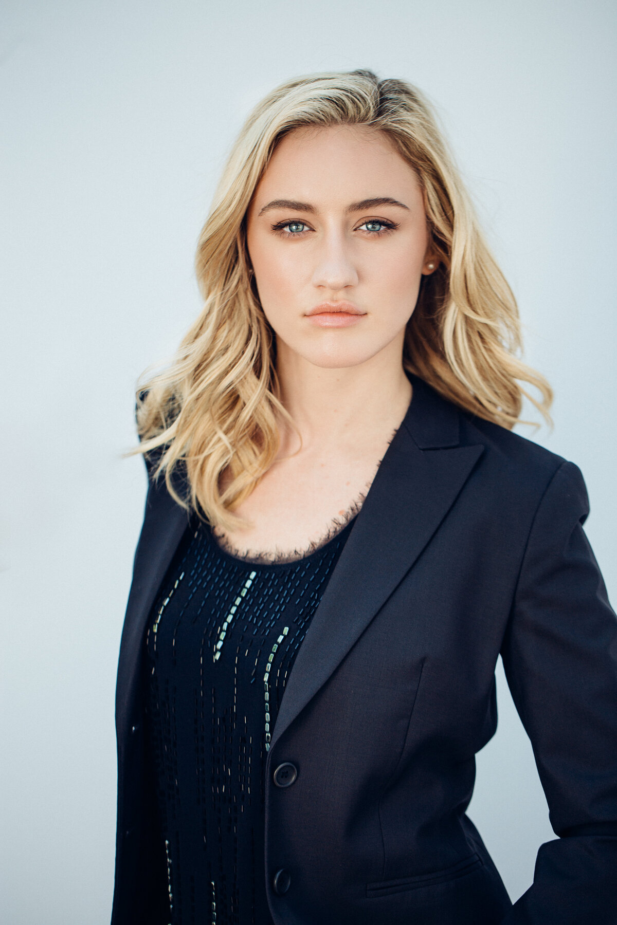 Headshot Photograph Of Young Woman In Outer Black Blazer And Inner Black Blouse Los Angeles