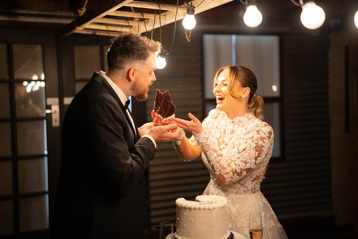 Married couple cutting their wedding cake