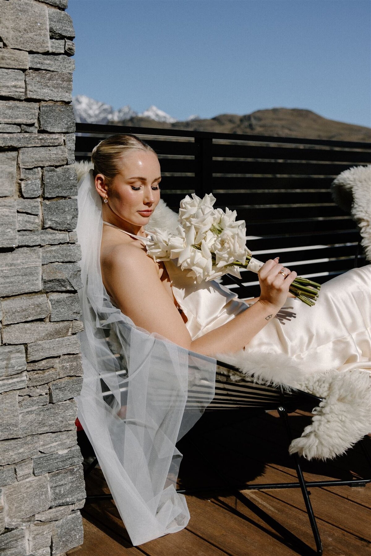 bride-posing-flowers-queenstown-wedding-model