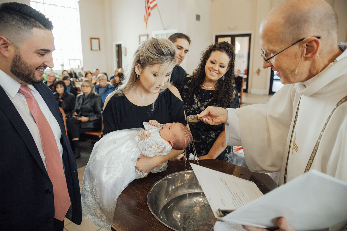Baptism Ceremony | Child being baptized surrounded by family | Hunterdon County, New Jersey