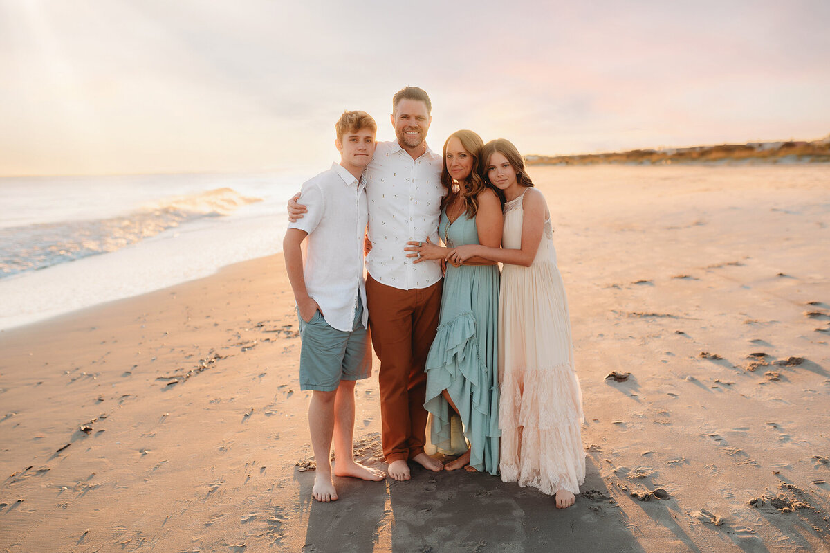 Family poses for Family Photos in Isle of Palms, South Carolina.