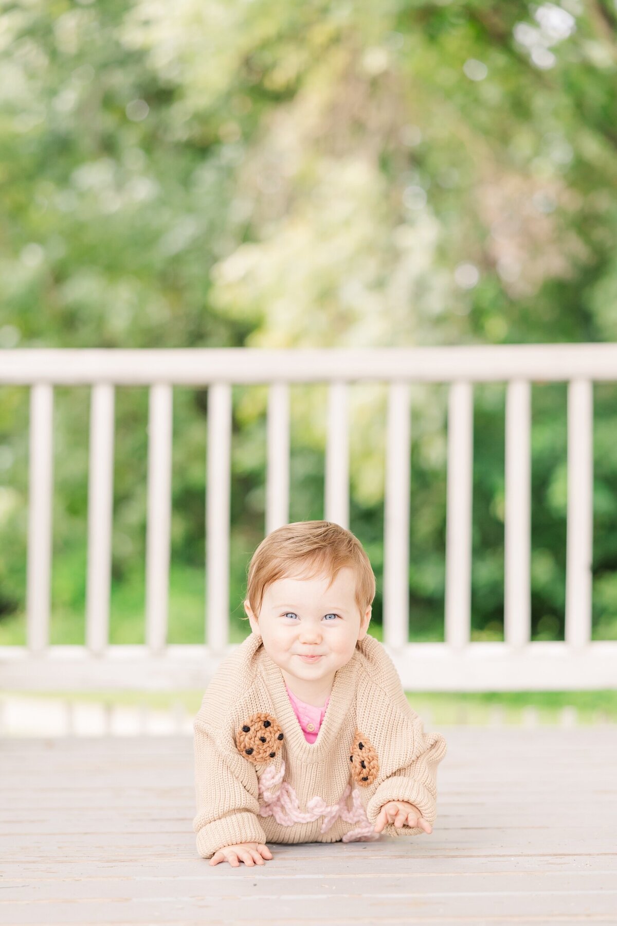 Baby girl crawling towards the camera by Erin Thompson Photography