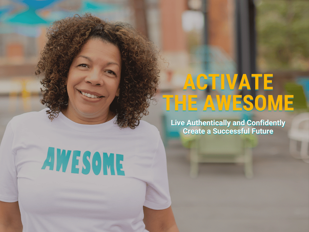 Photo of Michelle McKown-Campbell wearing a white t-shirt that says AWESOME in blue . Image overlayed with text that says "Activate the Awesome" with "Live Authentically and Confidently Create a Successful Future" underneath.