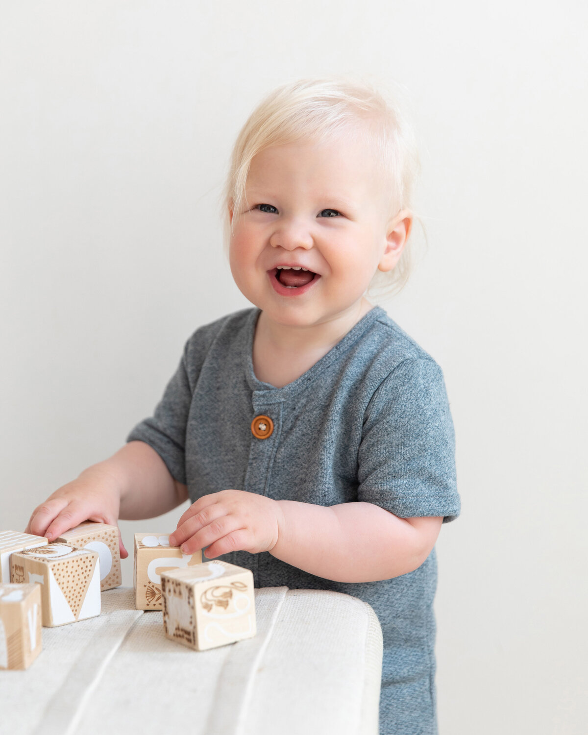 laughing-boy-playing-with-blocks