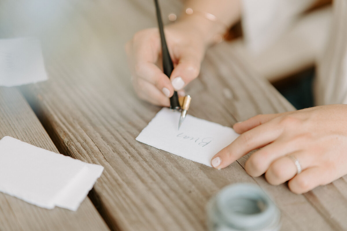 Woman writing on name card