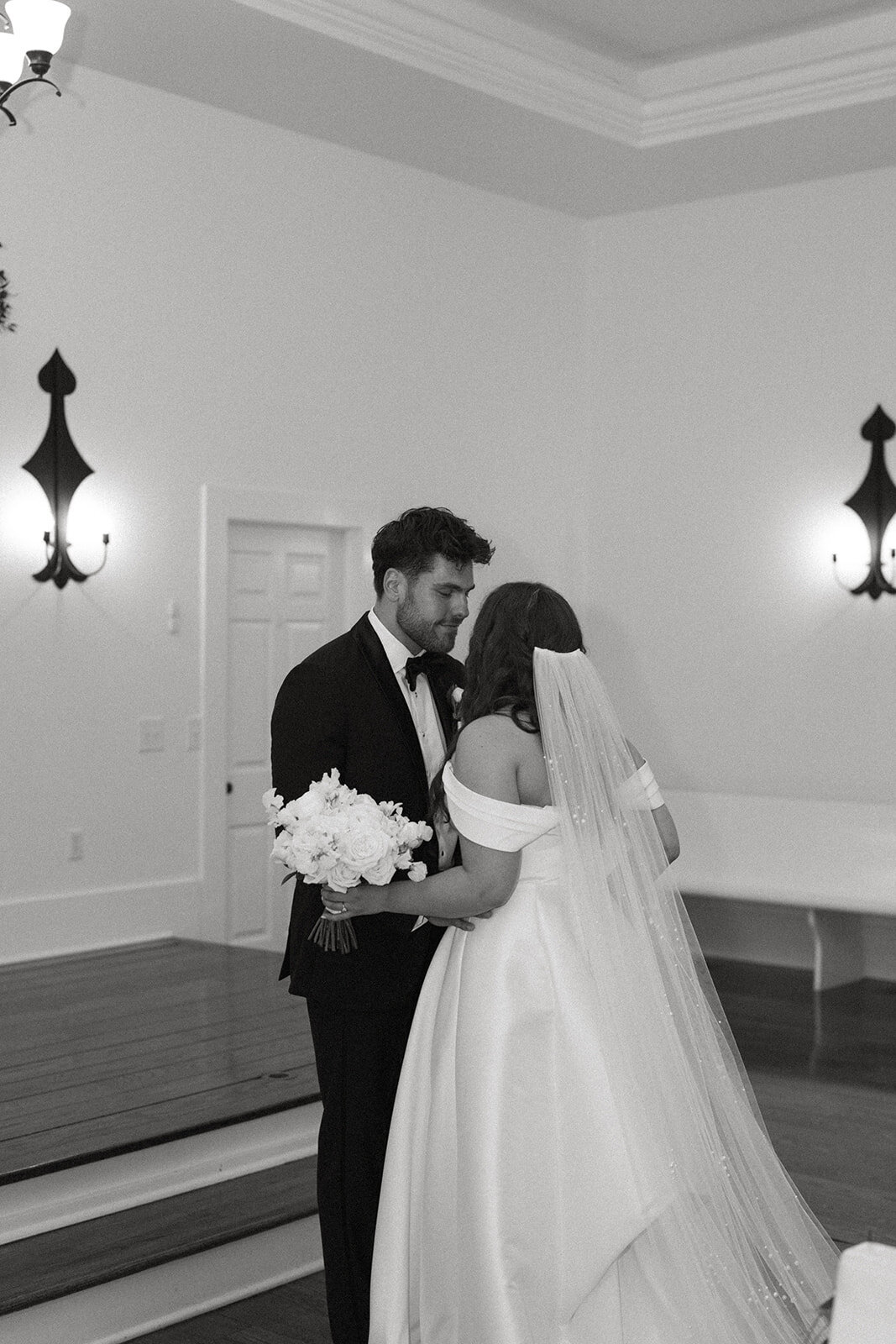 Groom’s emotional reaction during private moment with bride inside The Morris Estate chapel