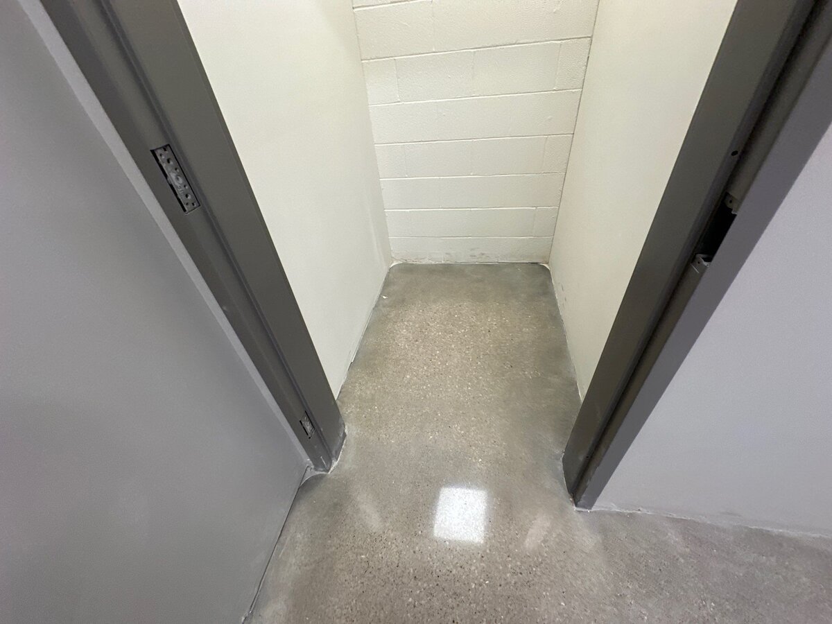 Commercial polished concrete flooring in DFW, showcasing a sleek and durable surface in a commercial space with professional installation.
