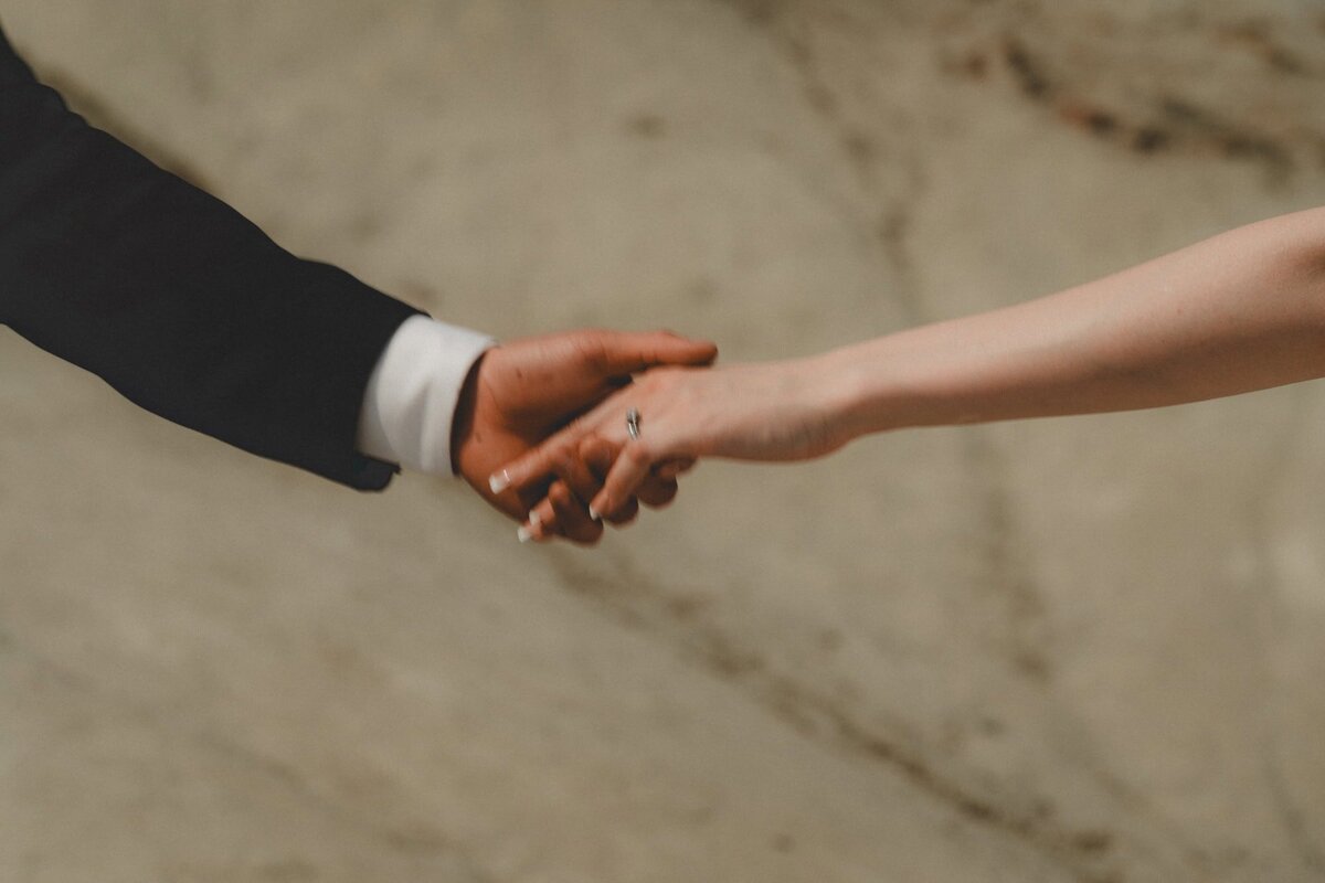 Wedding couple holding hands in Drumheller, Alberta