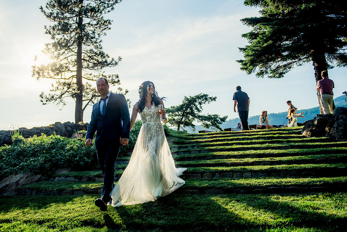 bride and groom walking down steps