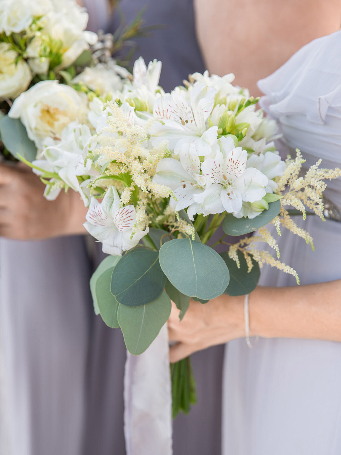destination-wedding-bali-amankila-lilies-orchids-bridesmaid-bouquet-tropical
