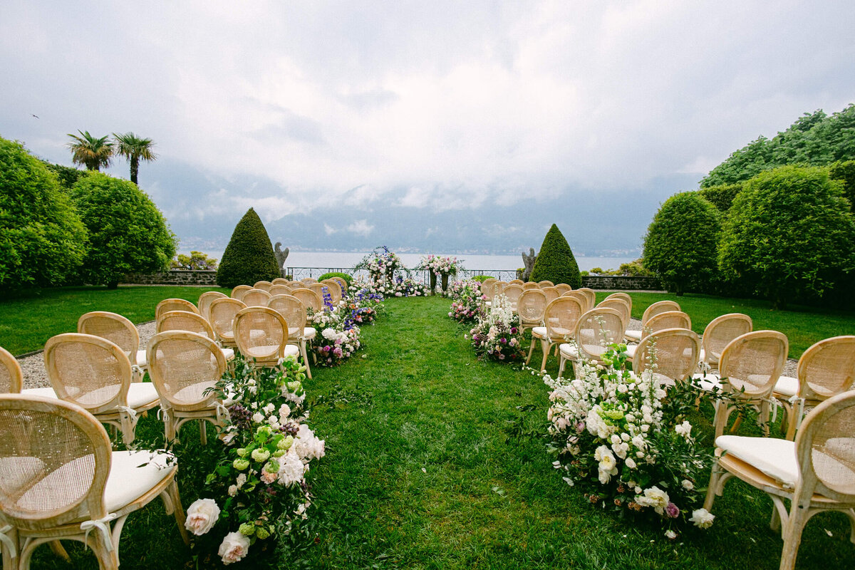 A wedding photo looking down the aisle t the ceremony at Villa Balbiano on Lake Como in Italy