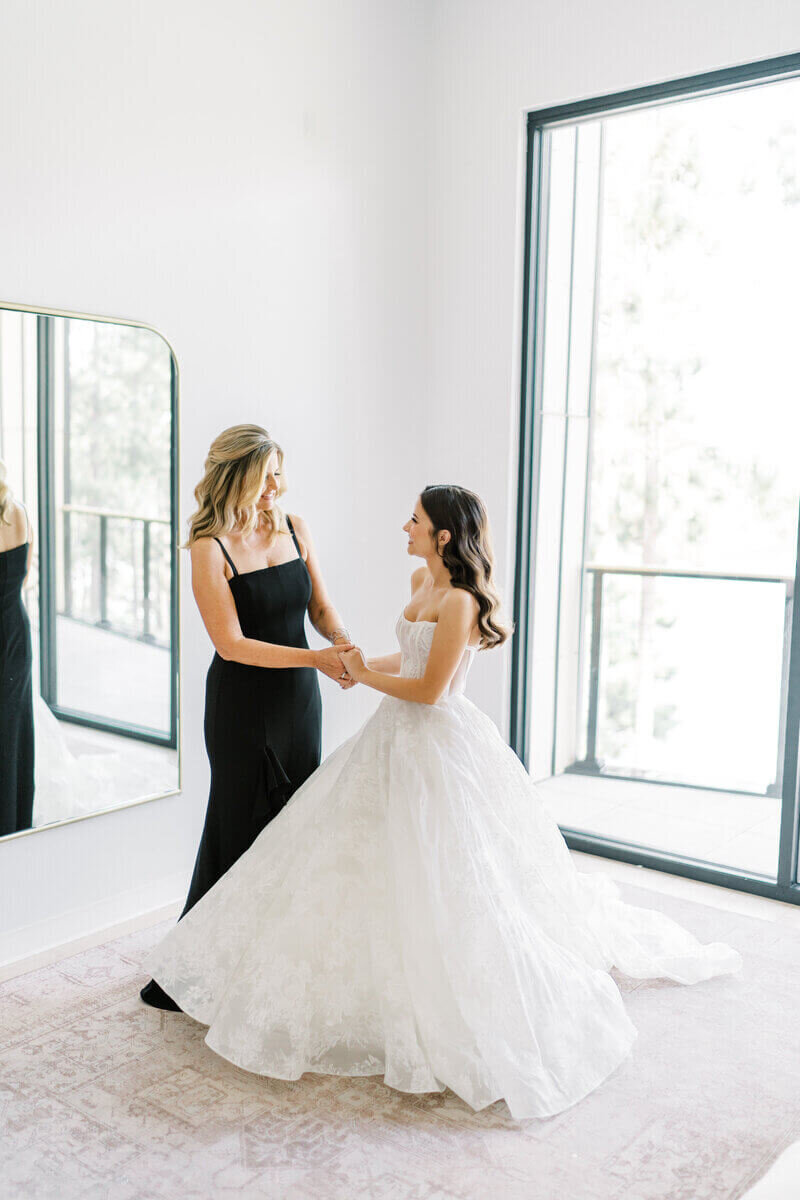 Bride and her mom holding hands by wedding planners chicago il