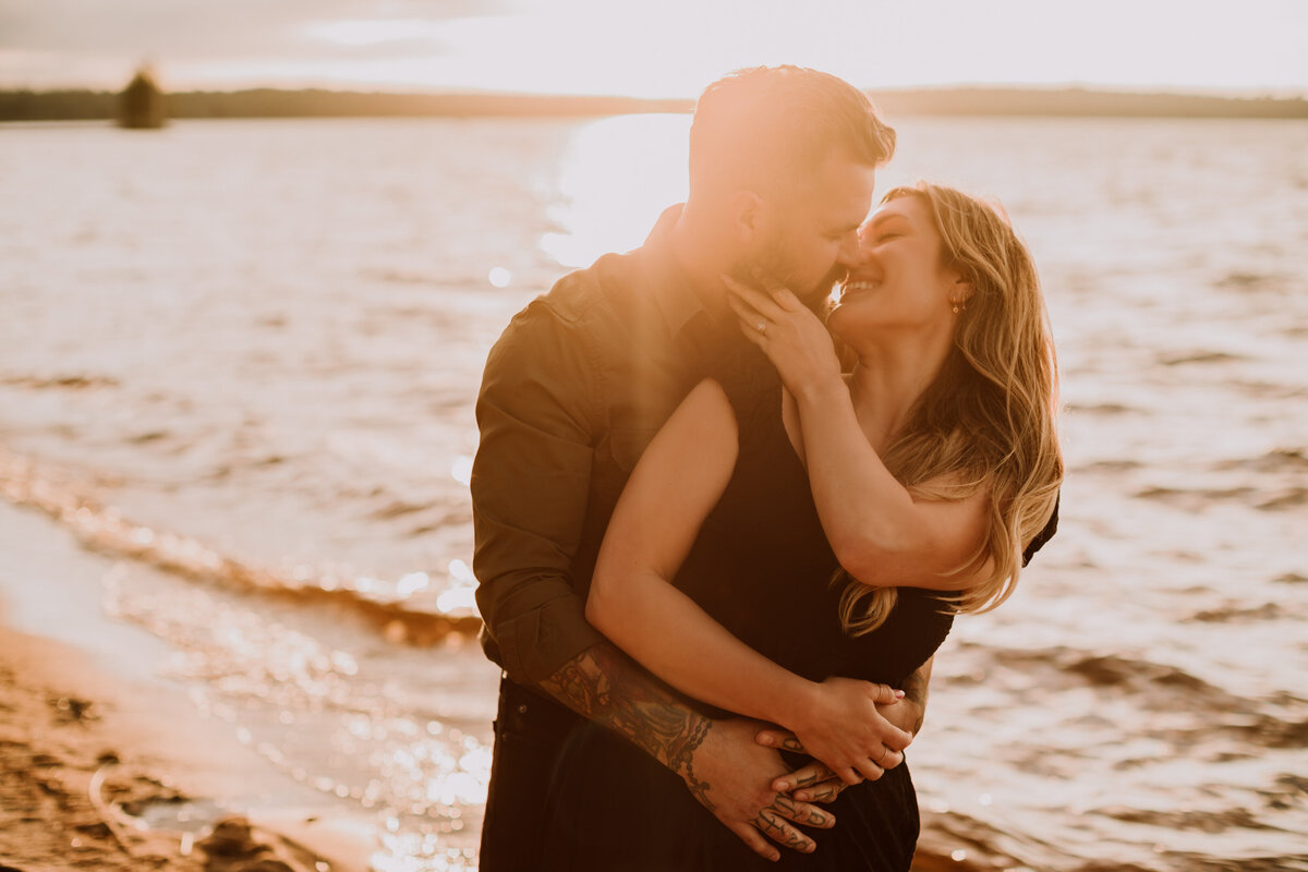 alana-andrew-engagement-cottage-beach-lake-sunset-dock-algonquin-21