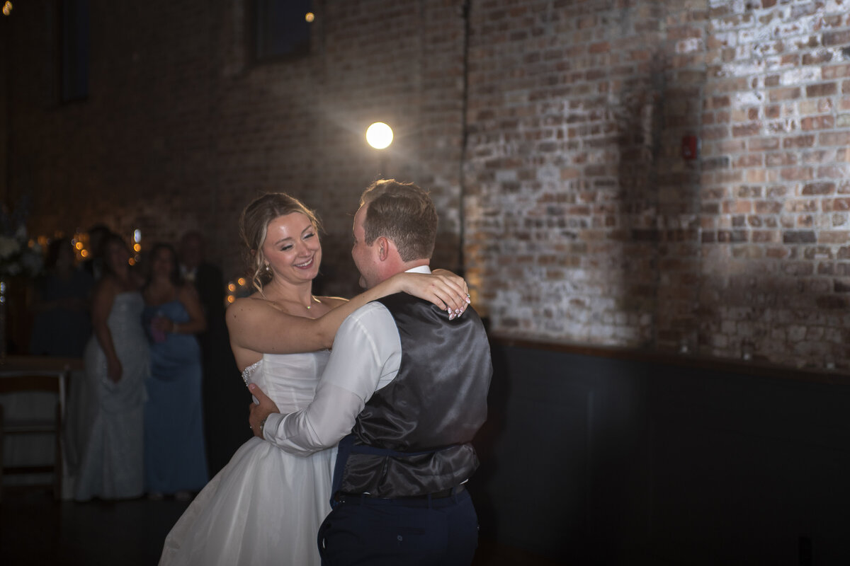 Bride and groom candid laugh during ceremony