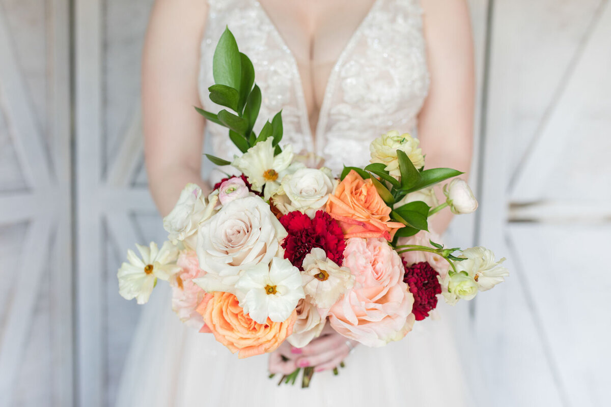 Bride holding a colorful bouquet