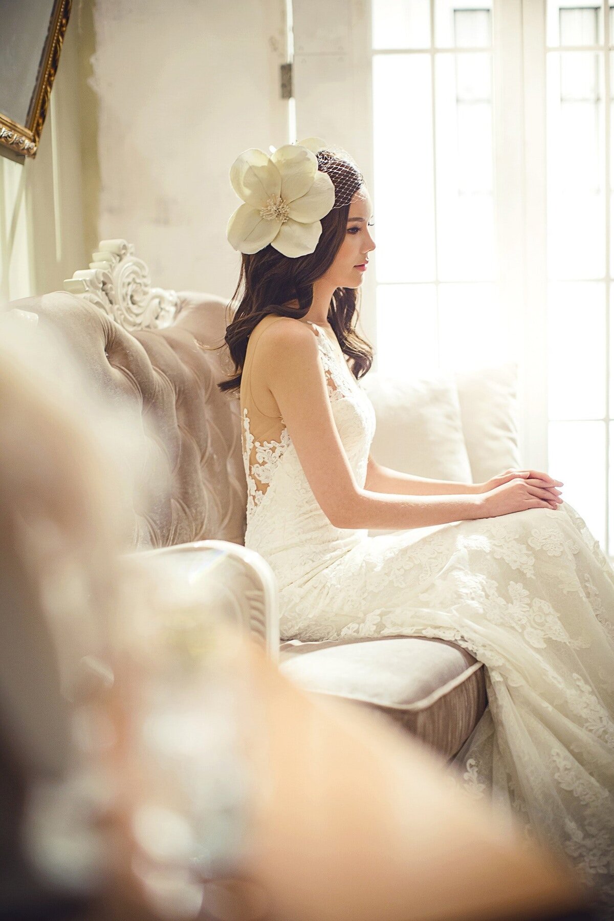 Bautiful bride by the windoww ina diffuse tender light- Beauty - Wedding day - Destination Wedding Photography
