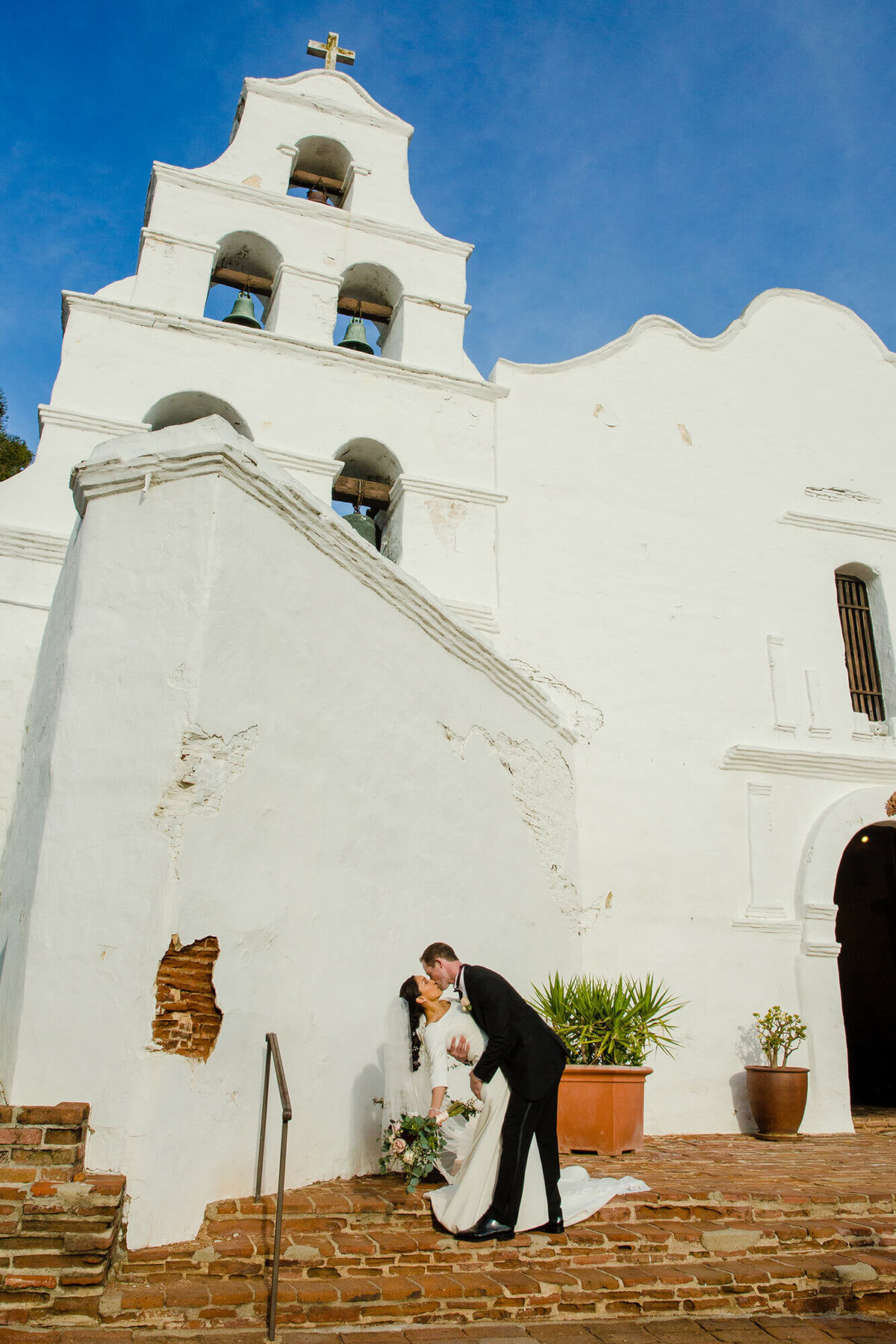 mission-basilica-san-diego-de-alcala-wedding-dip-kiss-bell-tower
