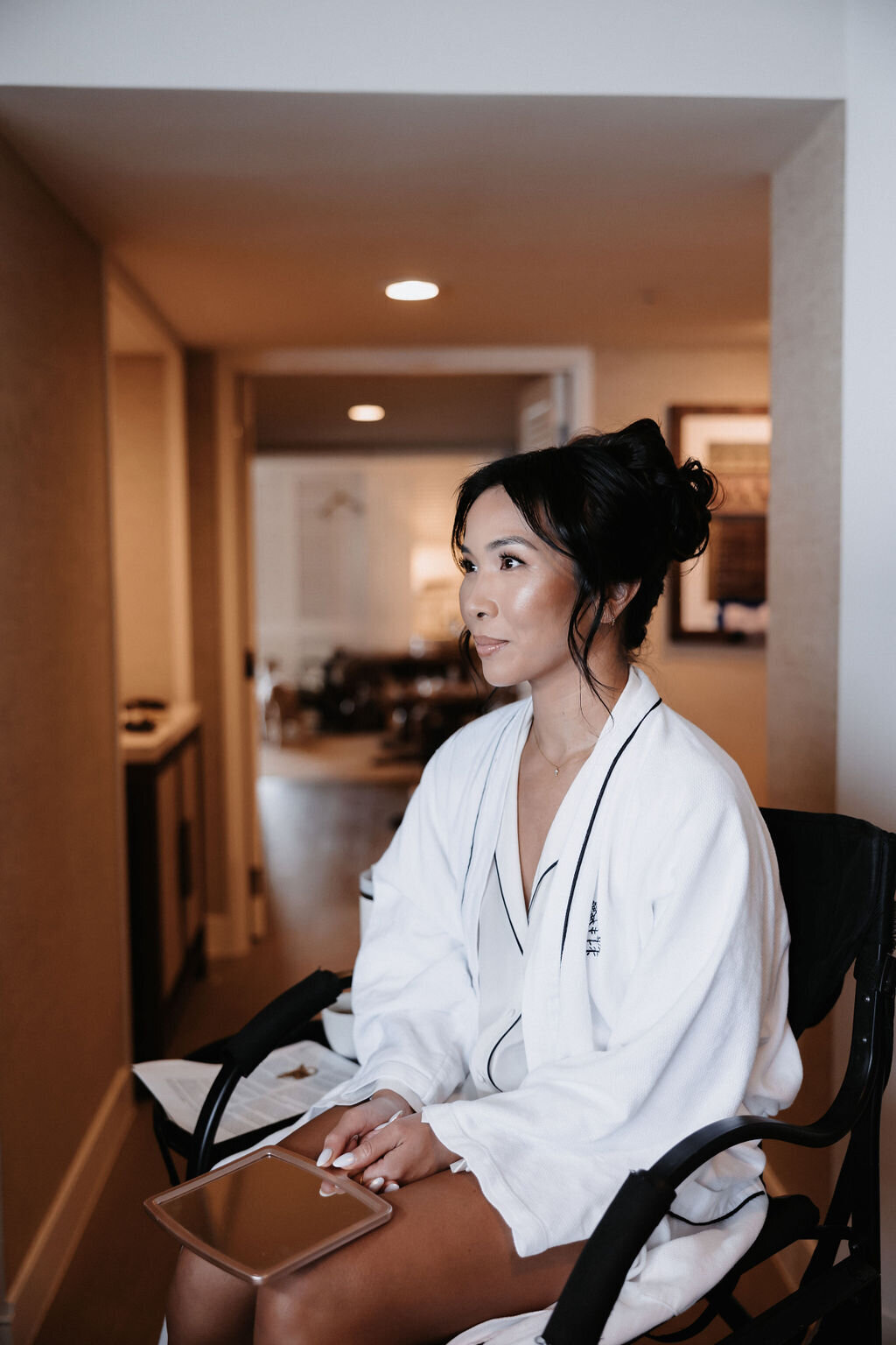 Bride getting hair and makeup done before her wedding at Four Seasons Oahu