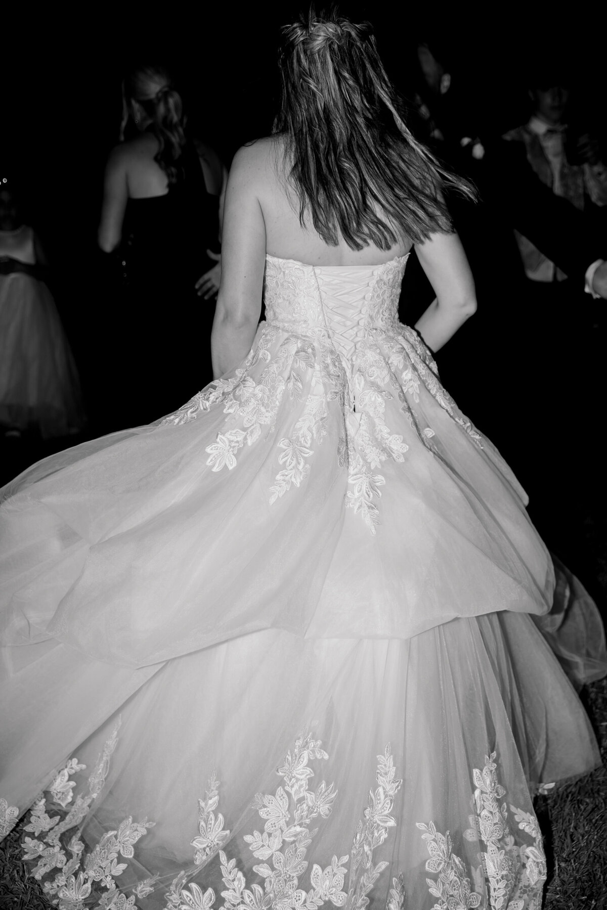 Spanish Wedding Villas | black and white image of bride’s dress twirling on dance floor