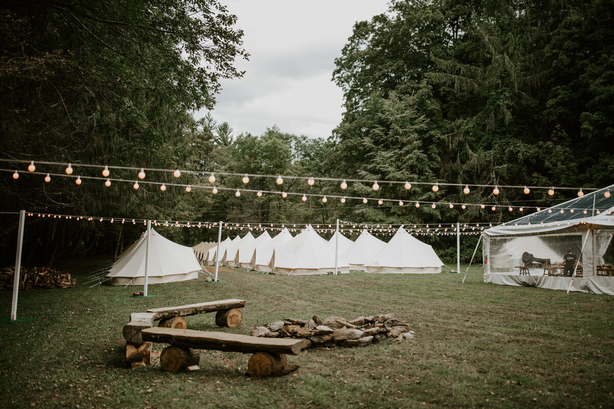 Glamping themed wedding with individual tents for guests accommodations