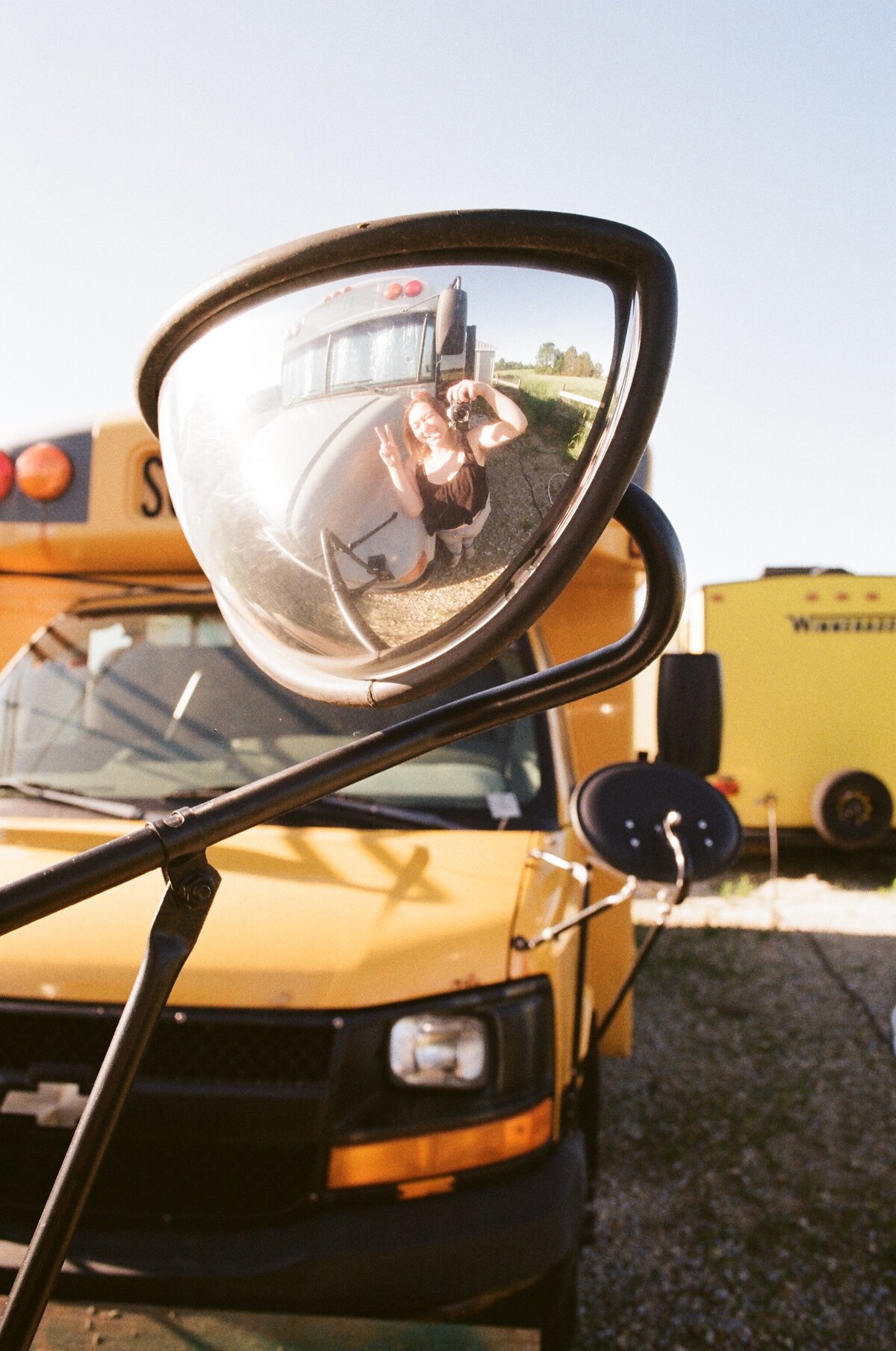mirror selfie of brianna kirk in the mirror of the school bus