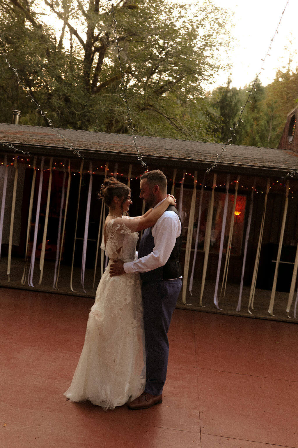 A bride and groom have their first dance at Thyme Garden wedding venue in Oregon.