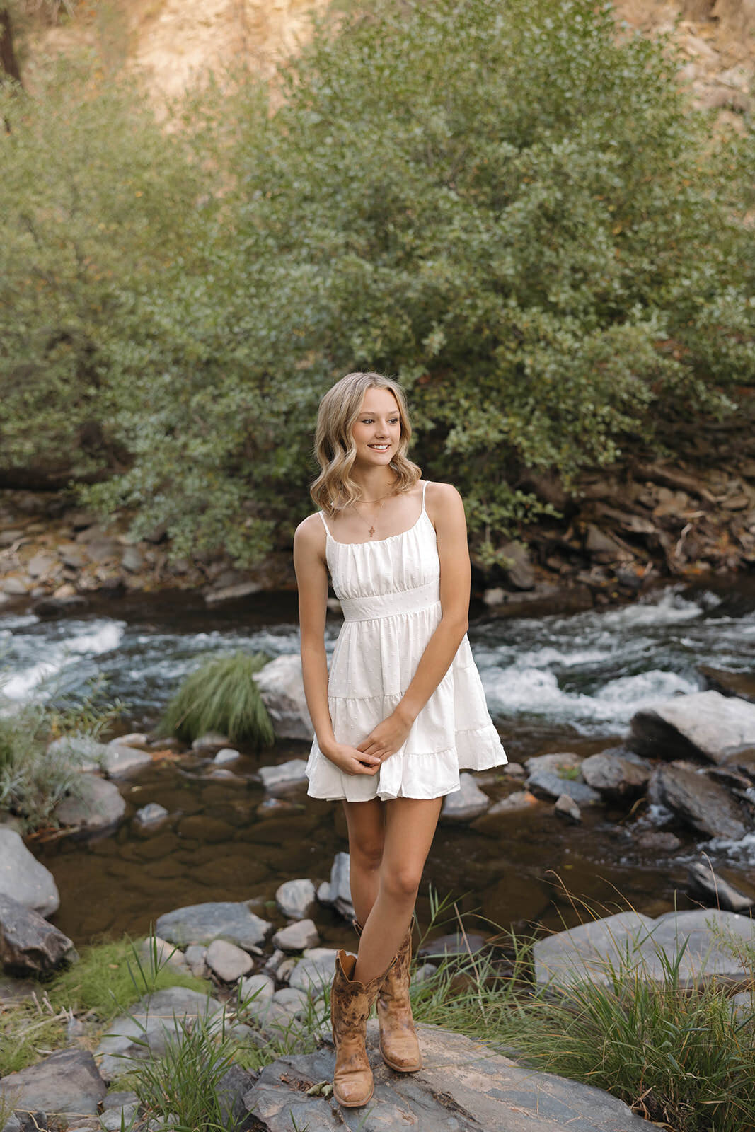Senior girl laughing at golden hour