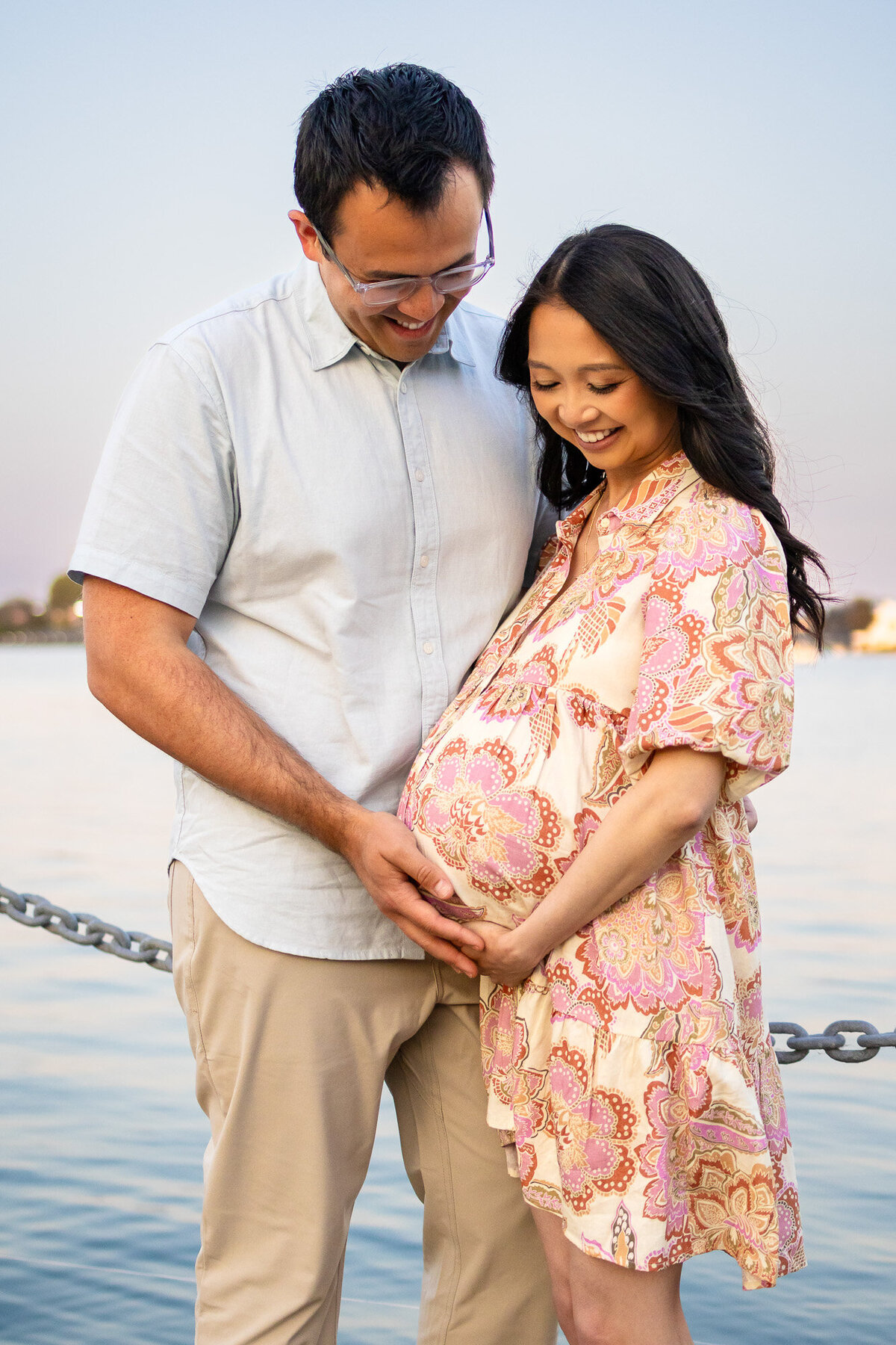 Tender moment with both parents holding baby bump and smiling — Bay Area Maternity Portfolio - Ellobelle Photography