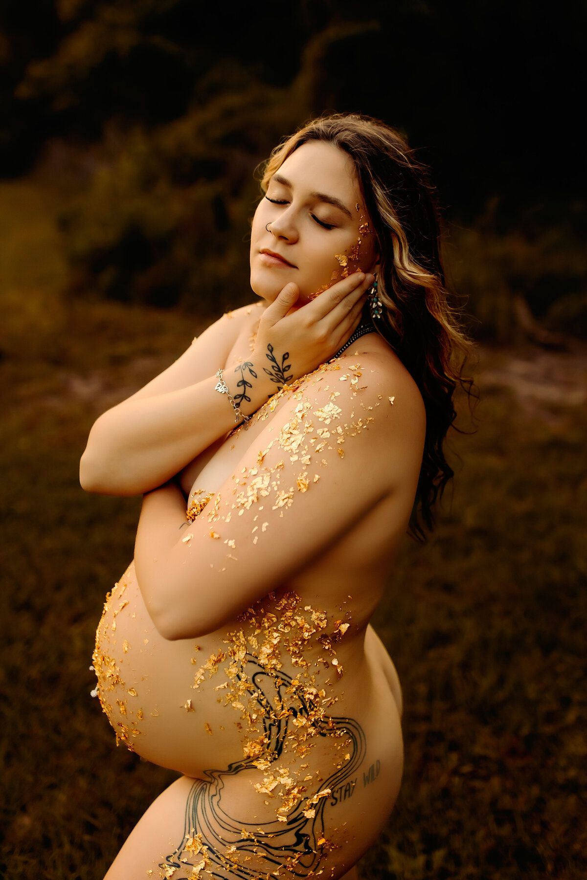 Radiant maternity boudoir portrait in gold leaf outdoors, Hardin, Texas