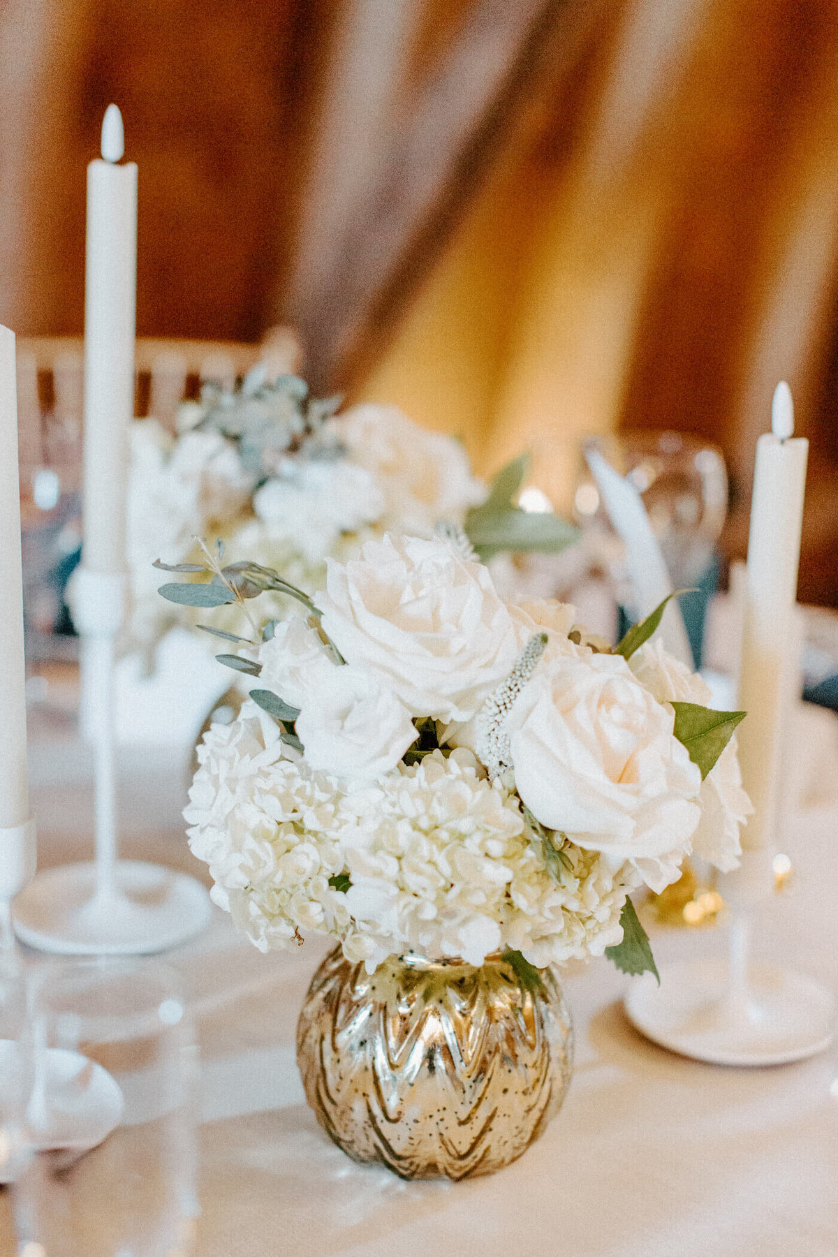 Wedding table setting with flowers and candles.