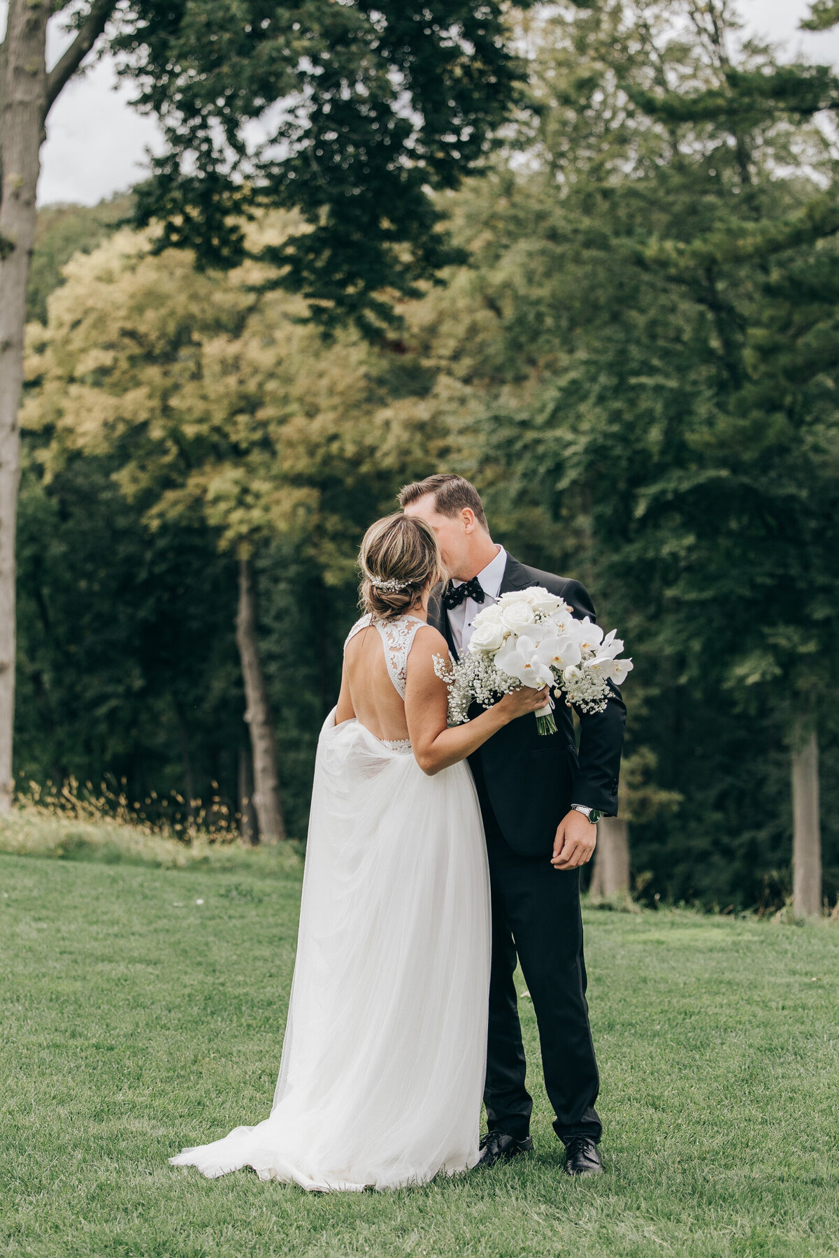 Bride and groom kissing after a romantic first look