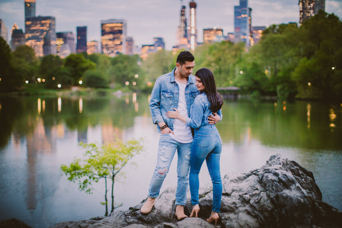 A couple in all denim standing on the hernshead rock at central park
