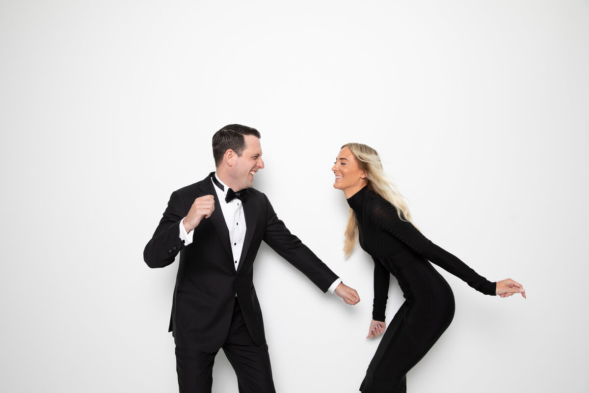 A couple dancing together and smiling