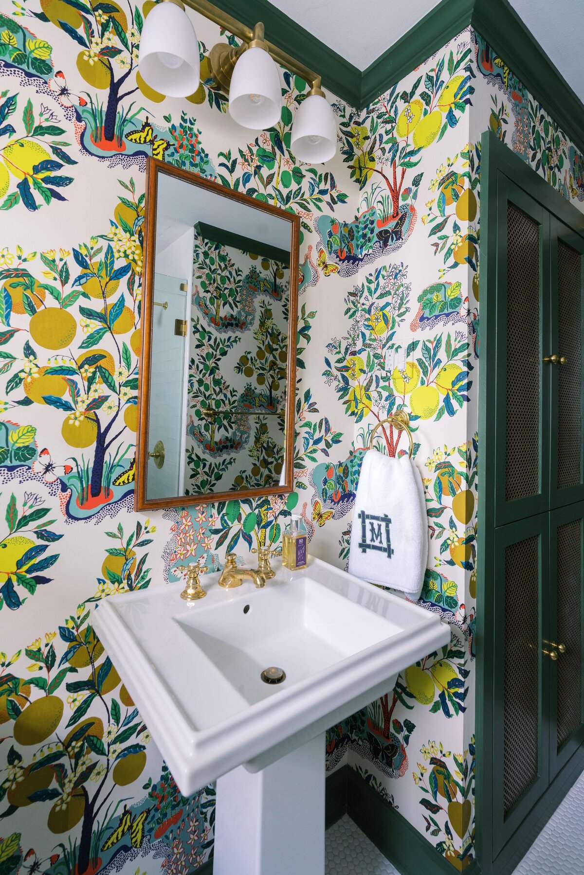 oyster creek studios happy valley pedestal sink and mirror in a bathroom with yellow wallpaper