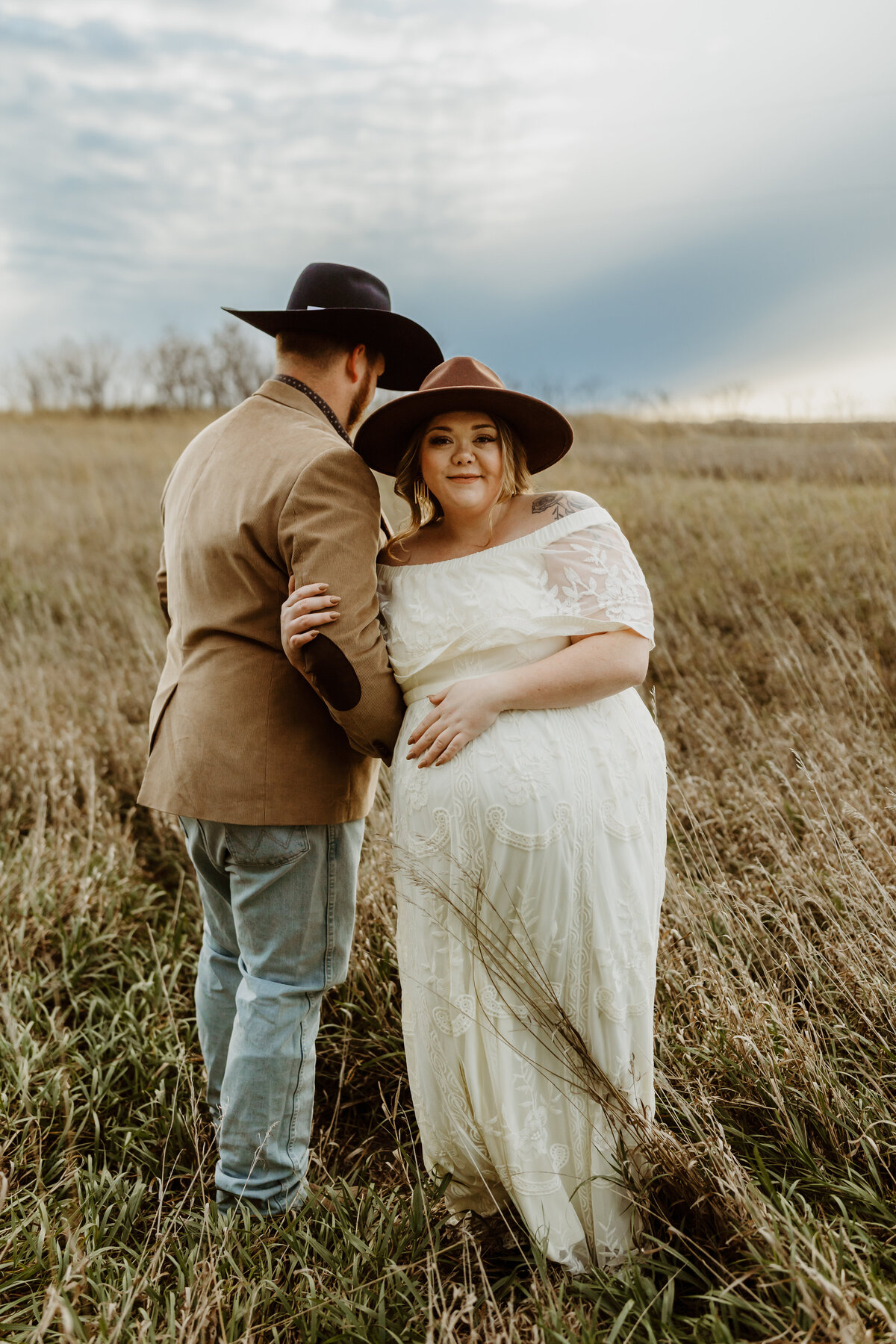 outdoor maternity session with mom and dad on a farm in the country