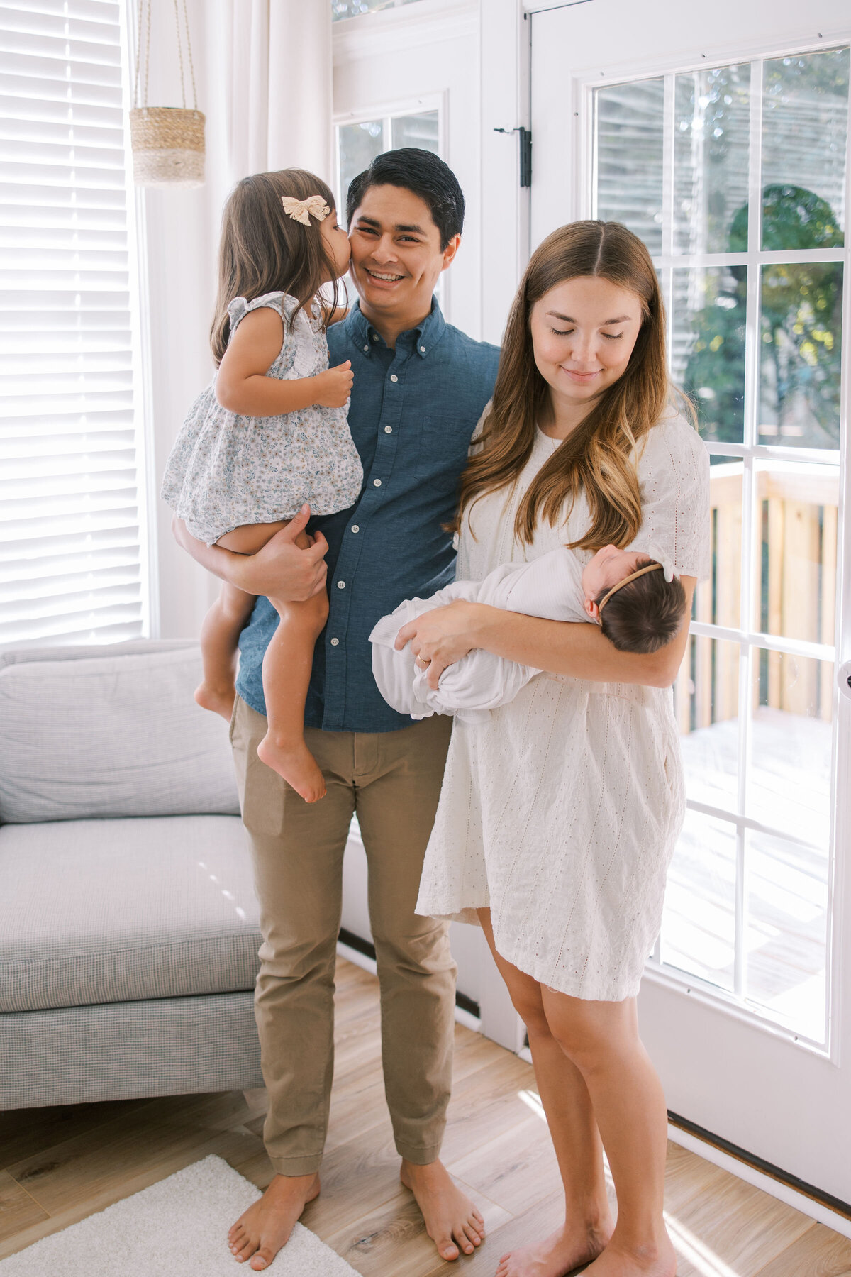 Family in home during Raleigh newborn photography