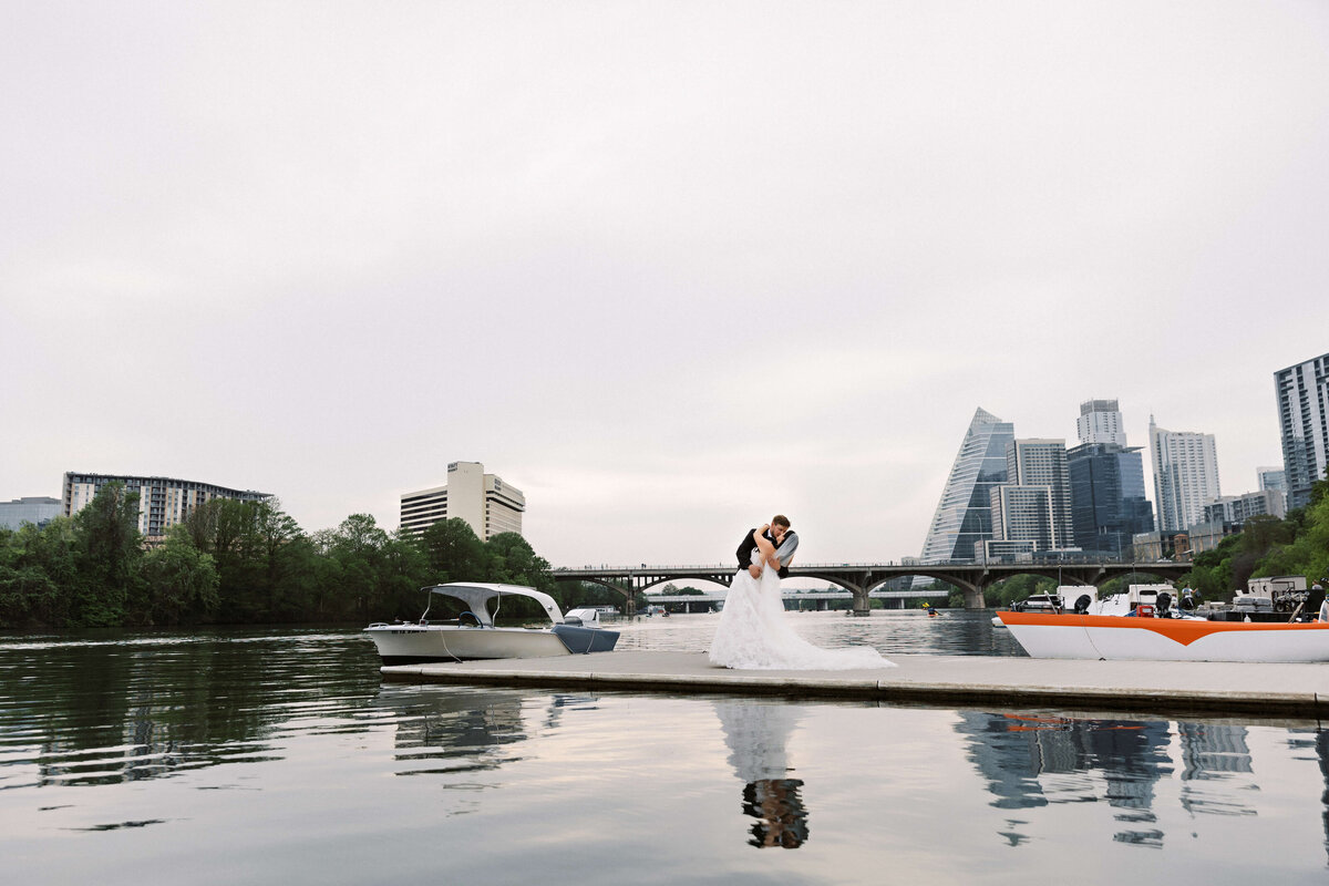 bride and groom by water in Austin