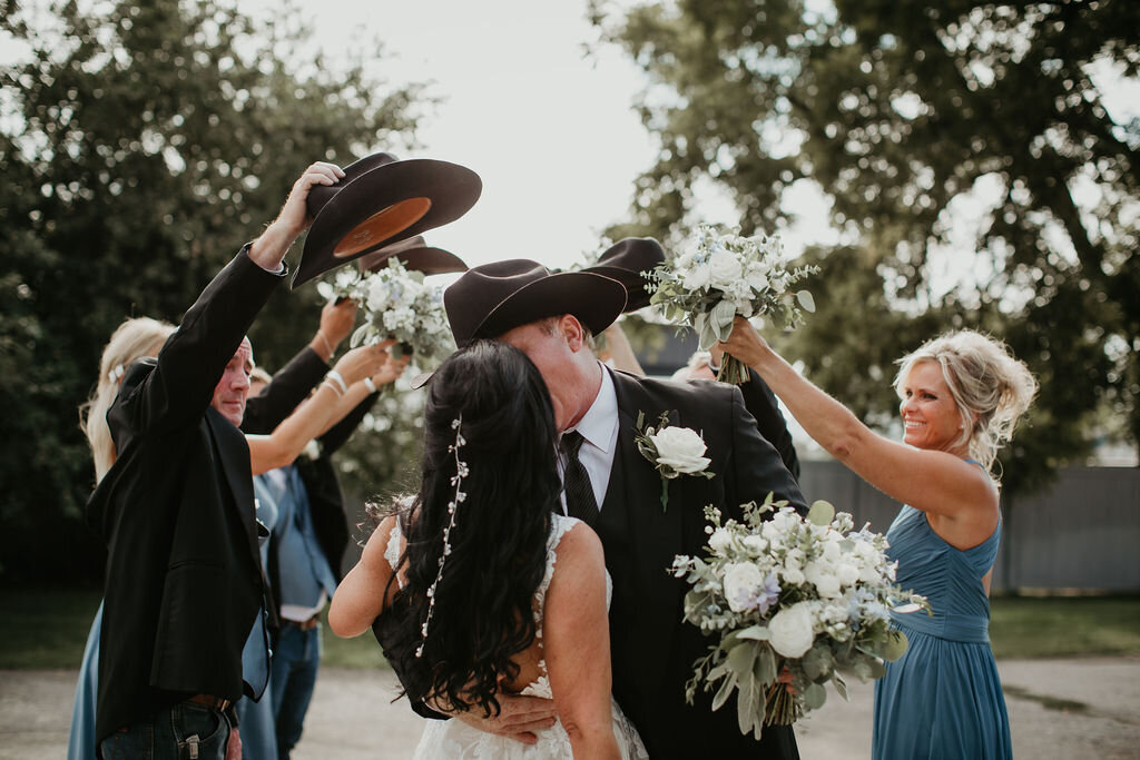 Bride and groom share a kiss